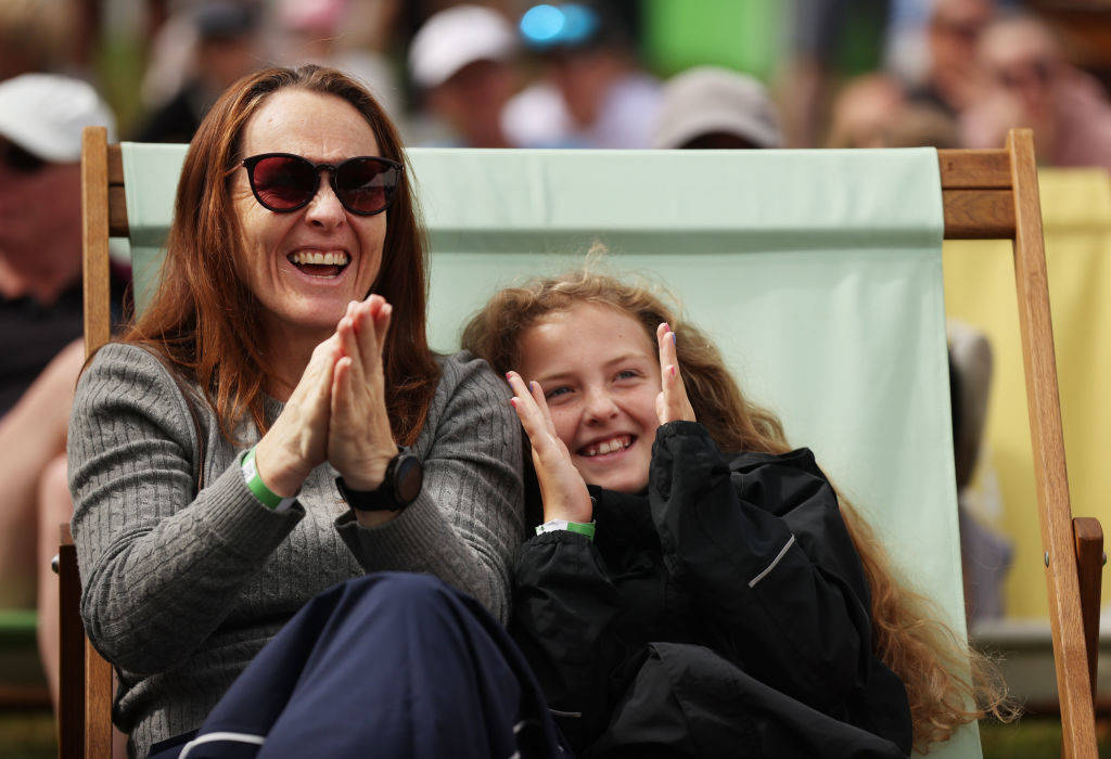 Two fans enjoying the festival village at the AIG Women